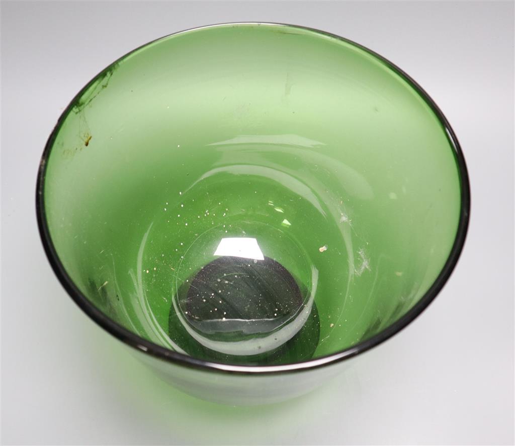 A green glass deep footed bowl, 25cm